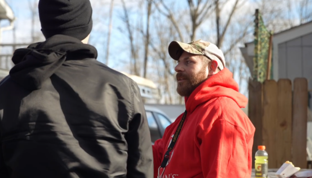 Veteran Walter Hummel meets with the Bachman's roofing team.
