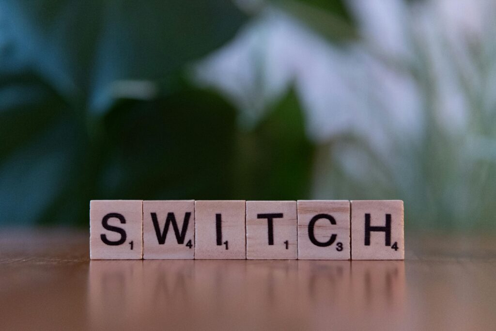 Close-up of wooden tiles spelling 'Switch', perfect for education and games themes.