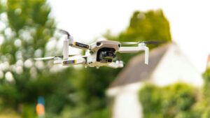A drone captures aerial views amidst vibrant nature in Brugge, Belgium.