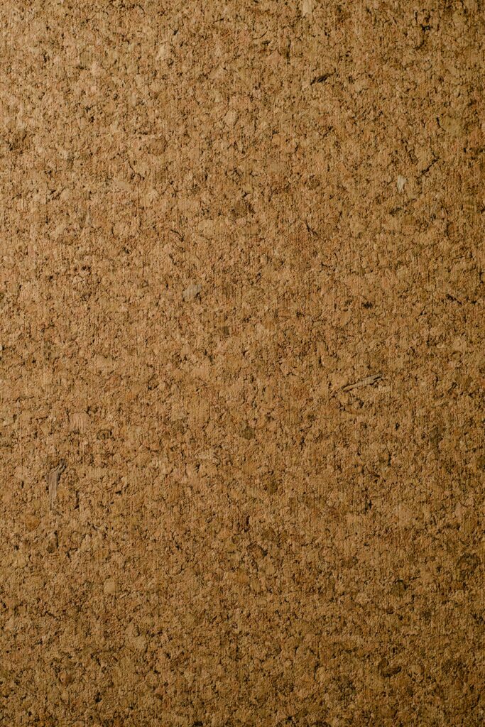 Close-up of a natural corkboard texture perfect for backgrounds and designs.