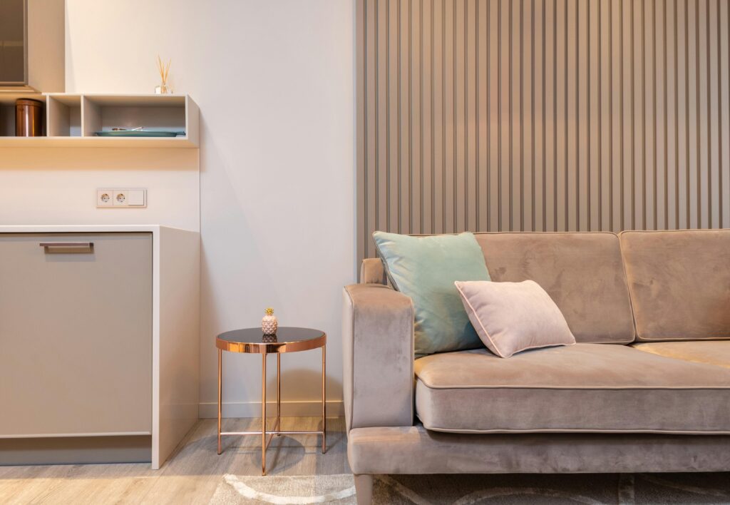 Stylish modern living room with a cozy sofa, accent table, and contemporary decor.