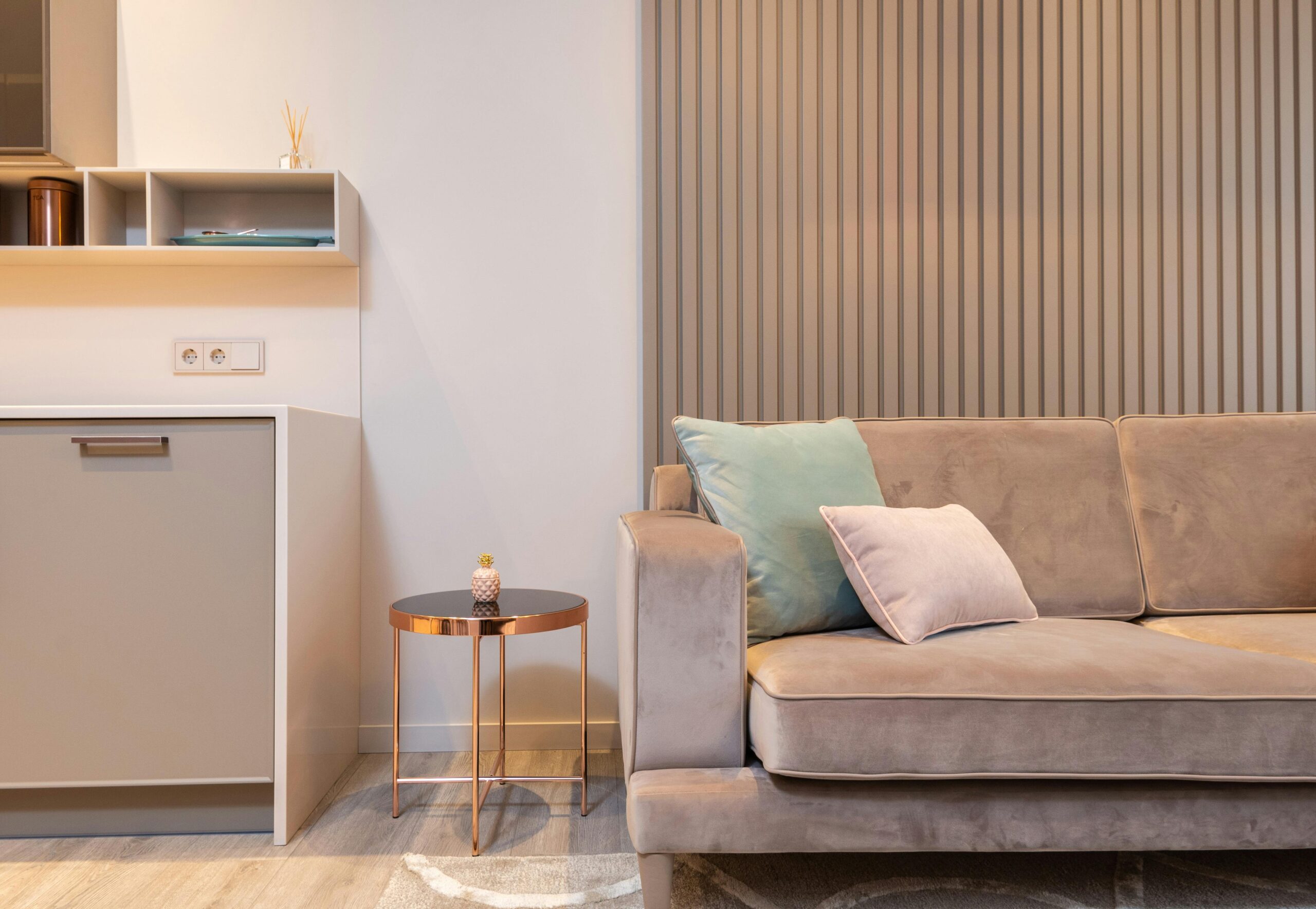 Stylish modern living room with a cozy sofa, accent table, and contemporary decor.