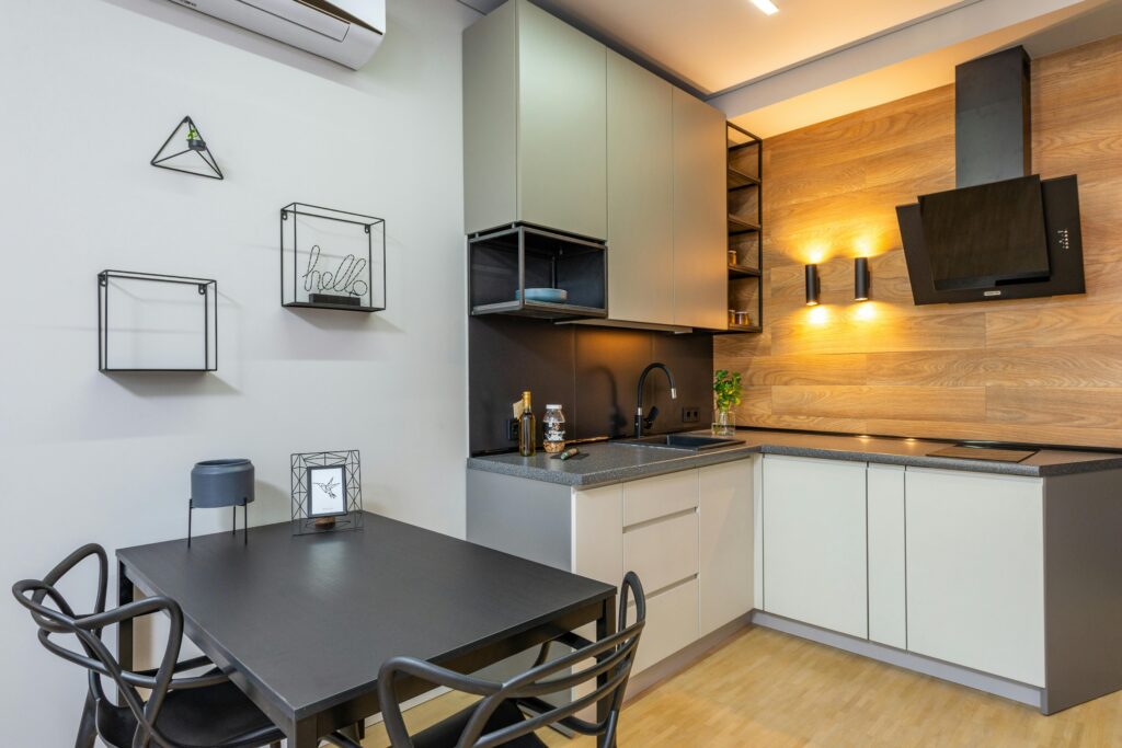 Stylish and modern kitchen interior with contemporary decor and lighting.