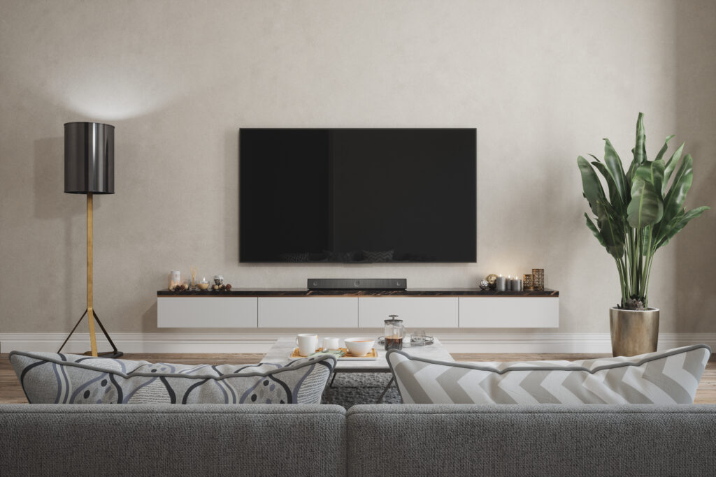 Cozy living room with optimal furniture layout facing a wall-mounted TV