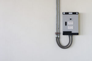 garage interior featuring a dedicated grey electrical subpanel mounted on a finished wall