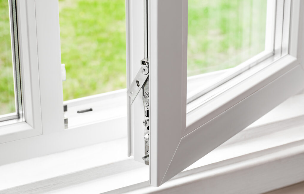 close-up of a modern window showing a sleek security lock and weatherstripping detail.