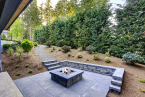 Stamped concrete patio with built-in seating, an example of concrete features for outdoor living areas