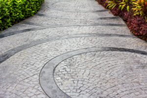 Stamped decorative concrete landscaping patio with earthy tones