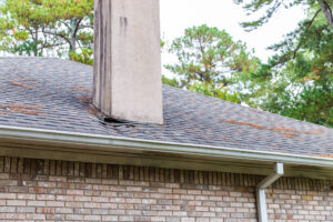 structural sagging in roofline showing dip along ridge line of older home