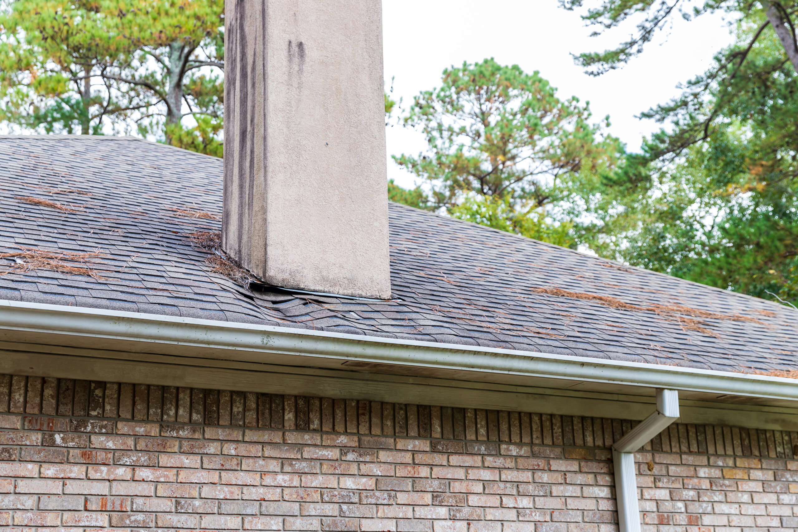 structural sagging in roofline showing dip along ridge line of older home