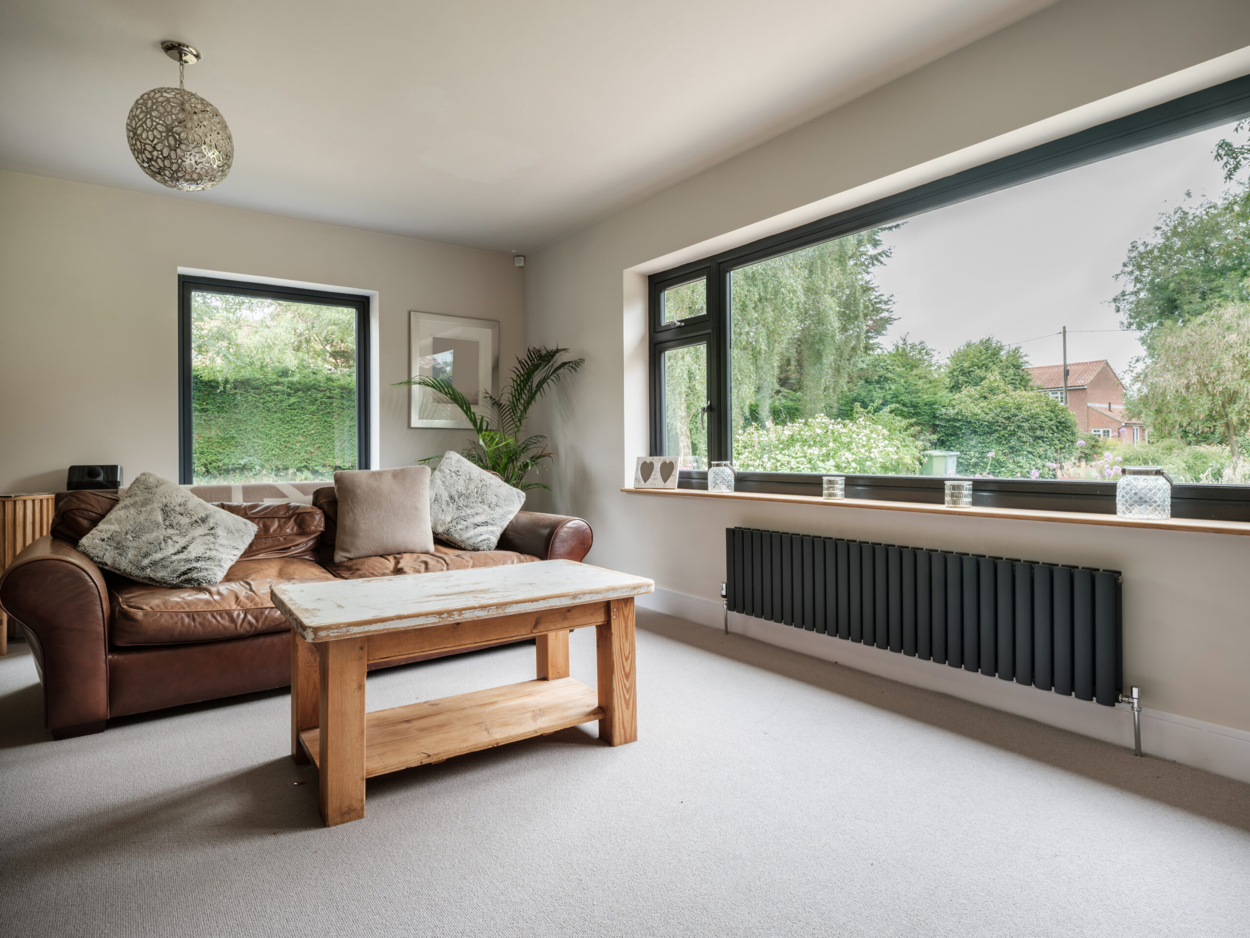 Large picture window in a living room, an example of window placement for natural light