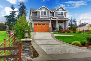 Decorative concrete design elevates a front entryway with a geometric pattern and textured finish.
