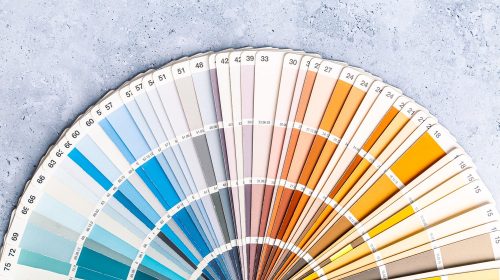 Industrial color palette guide of paint samples catalog on grey background