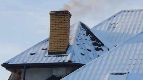 Close up chimney on the roof. Winter