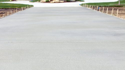 New Concrete Driveway Leads to Expensive House