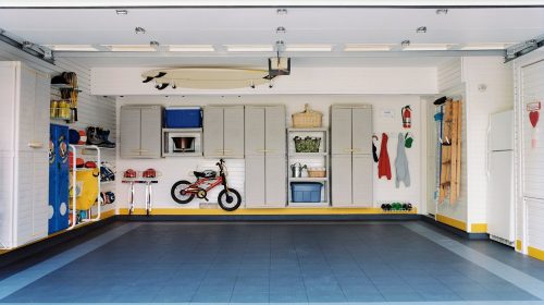 Surfboards and bicycles in empty garage