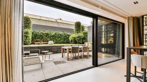 Attractive huge sliding glass door leading to the courtyard