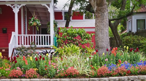 House with flower garden in front. St Augustine Florida.