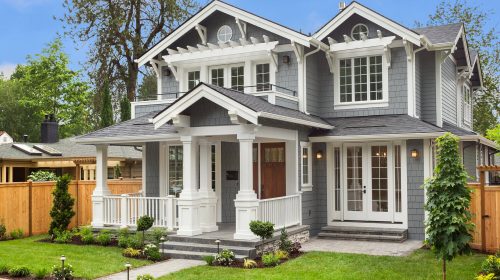 new luxury home with elegant touches including covered entrance, columns