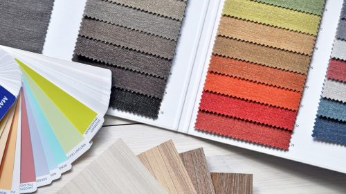 Colorful fabric and paint swatches laid out for design inspiration and material selection.